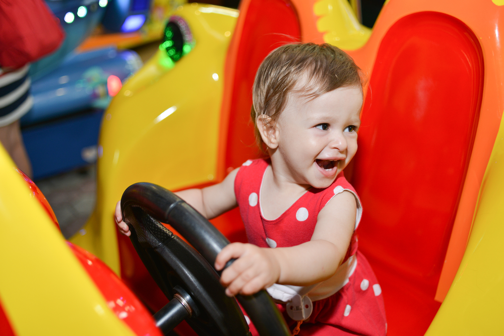 todler having fun in a toy shop in new york