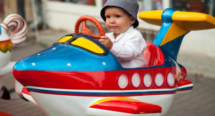 child riding a ride at orlando theme park