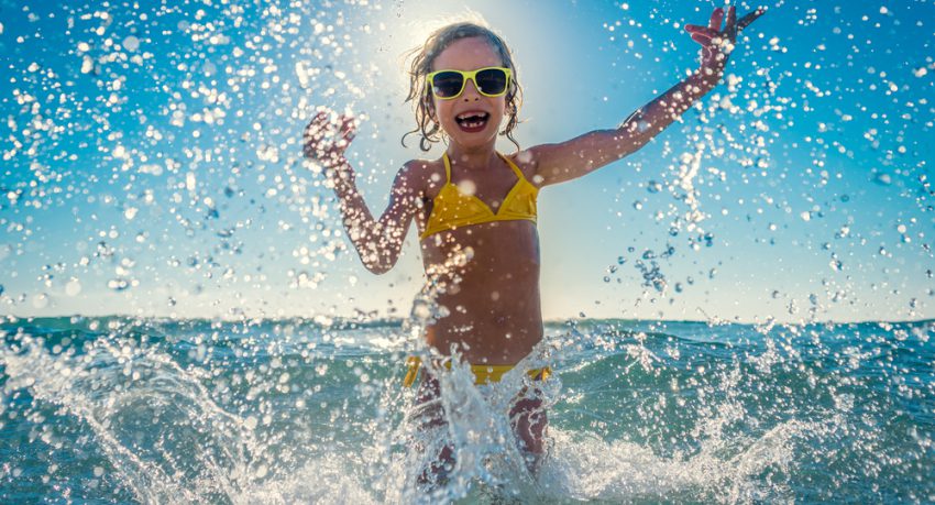 child enjoying the sea